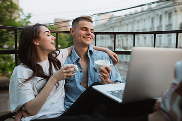 Image showing Quarantine lockdown, stay home concept - young beautiful caucasian couple enjoying new lifestyle during coronavirus worldwide health emergency