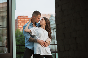 Image showing Quarantine lockdown, stay home concept - young beautiful caucasian couple enjoying new lifestyle during coronavirus worldwide health emergency