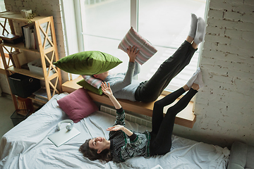 Image showing Quarantine lockdown, stay home concept - young beautiful caucasian couple enjoying new lifestyle during coronavirus worldwide health emergency