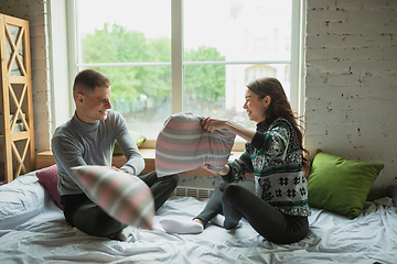 Image showing Quarantine lockdown, stay home concept - young beautiful caucasian couple enjoying new lifestyle during coronavirus worldwide health emergency