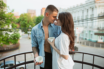 Image showing Quarantine lockdown, stay home concept - young beautiful caucasian couple enjoying new lifestyle during coronavirus worldwide health emergency