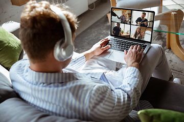 Image showing Caucasian man during online concert at home isolated and quarantined, impressive improvising, listening to band playing