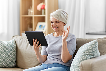 Image showing senior woman having video call on tablet pc