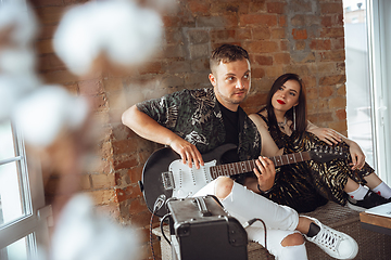 Image showing Caucasian musicians during online concert at home insulated and quarantined, cheerful and happy, impressive improvising