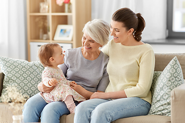 Image showing mother, daughter and grandmother on sofa at home