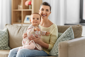 Image showing happy mother with little baby daughter at home