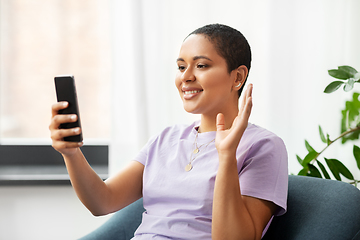 Image showing woman with smartphone having video call at home