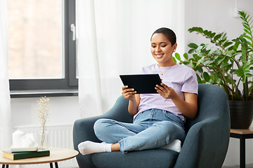 Image showing african american woman with tablet pc at home