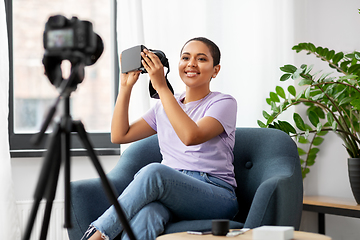 Image showing female blogger with camera and vr glasses at home