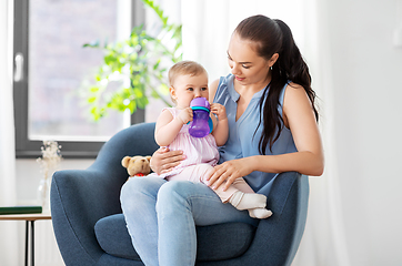 Image showing happy mother with little baby daughter at home