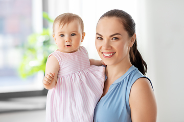 Image showing happy mother with little baby daughter at home