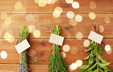 Image showing lavender, dill and peppermint on wooden background