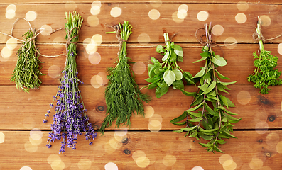 Image showing greens, spices or medicinal herbs on wood