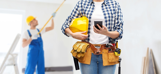 Image showing woman or builder with phone and working tools