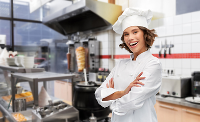 Image showing happy female chef with crossed arms at kebab shop