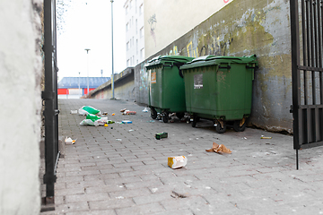 Image showing dumpsters on messy city street or courtyard