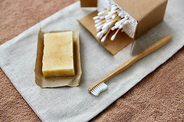 Image showing wooden toothbrush, handmade soap cotton swabs