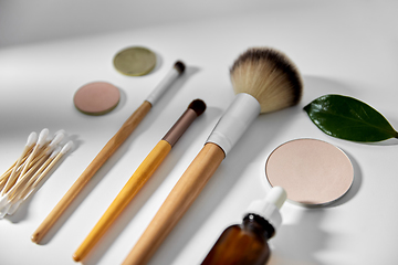 Image showing make up brushes, cosmetics and cotton swabs