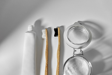 Image showing washing soda and wooden toothbrushes