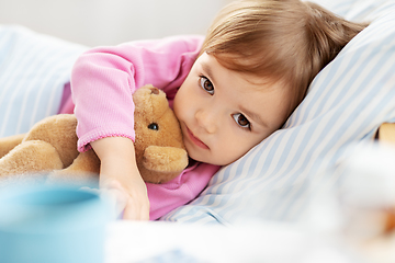 Image showing little girl lying in bed at home