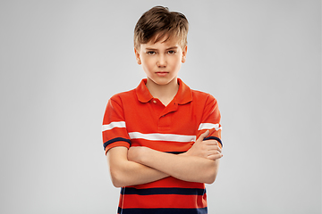 Image showing portrait of unhappy boy in red polo t-shirt