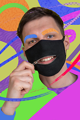 Image showing Portrait of a young man with freaky appearance, look and bright colorful painted design