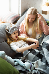 Image showing Mother and daughter, sisters have quite, beauty and fun day together at home. Comfort and togetherness. Waking up in bedroom, good morning.