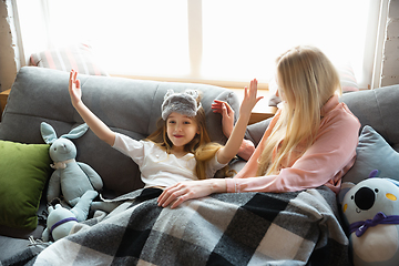 Image showing Mother and daughter, sisters have quite, beauty and fun day together at home. Comfort and togetherness. Waking up in bedroom, good morning.