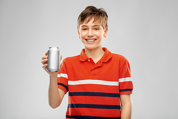 Image showing happy smiling boy holding soda drink in tin can