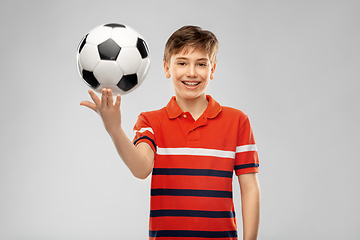 Image showing happy smiling boy holding soccer ball