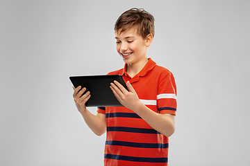 Image showing happy smiling boy using tablet computer