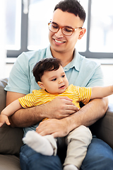 Image showing happy father with little baby son at home