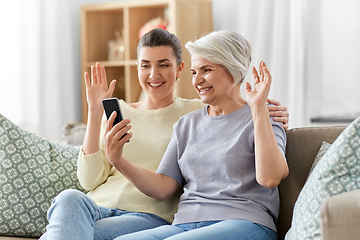 Image showing daughter and old mother having video call on phone