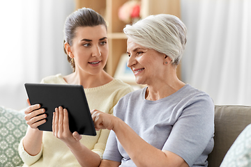 Image showing daughter and senior mother with tablet pc at home