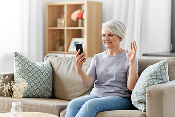 Image showing senior woman having video call on smartphone