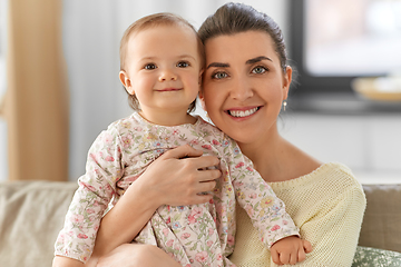 Image showing happy mother with little baby daughter at home