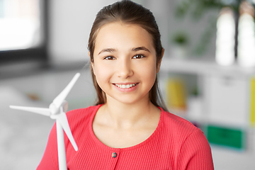 Image showing happy teenage girl with toy wind turbine