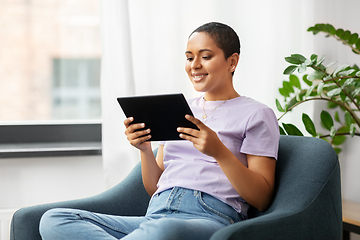 Image showing african american woman with tablet pc at home