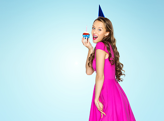 Image showing happy woman or teen girl with birthday cupcake