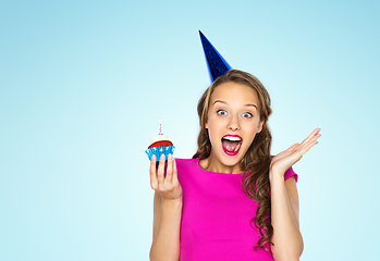 Image showing happy woman or teen girl with birthday cupcake