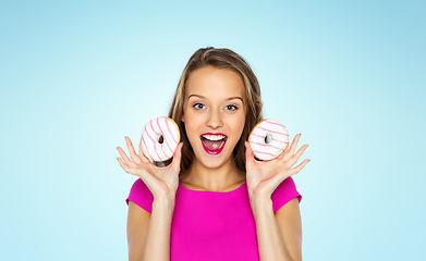 Image showing happy woman or teen girl with donuts