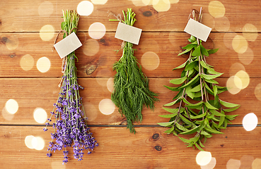 Image showing lavender, dill and peppermint on wooden background