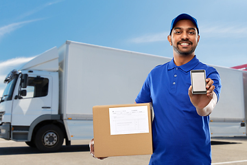 Image showing indian delivery man with smartphone and parcel box