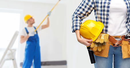 Image showing woman or builder with helmet and working tools