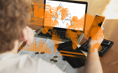 Image showing Interface modern technology and digital layer effect. Man counting, working in despair, went bankrupt. Business, finance crisis, economics recession, unemployment concept.