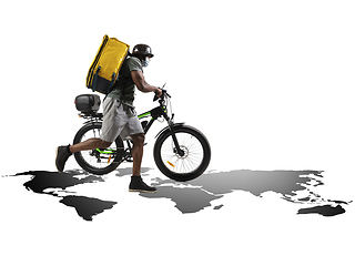 Image showing Home delivery, food purchase via the Internet. Deliveryman on bike arriving to any address worldwide on the map with your order.