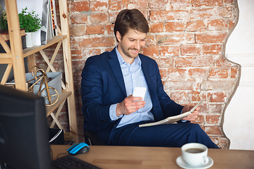 Image showing Young man, manager, team led return to work in his office after quarantine, feels happy and inspired