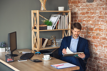 Image showing Young man, manager, team led return to work in his office after quarantine, feels happy and inspired