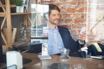 Image showing Young man, manager, team led return to work in his office after quarantine, feels happy and inspired