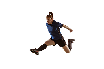 Image showing Female soccer, football player kicking ball, training in action and motion with bright emotions isolated on white background